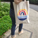 A woman wearing tote bag