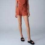 A woman wearing cross platform sandals - black