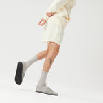 Man wearing grey pool slides with socks and shorts (2385873600589)