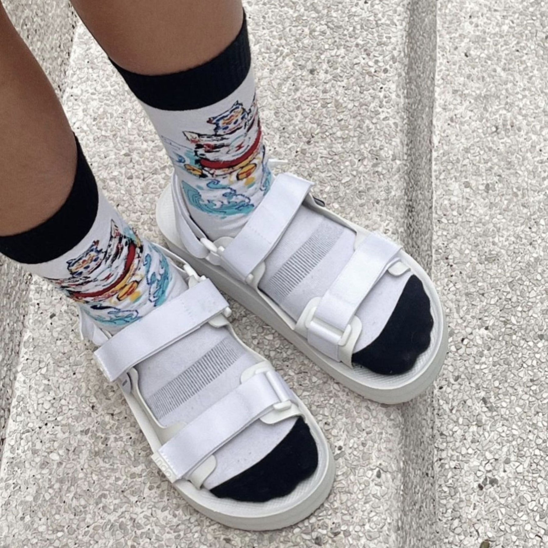 Woman wearing white adventure sandals with socks