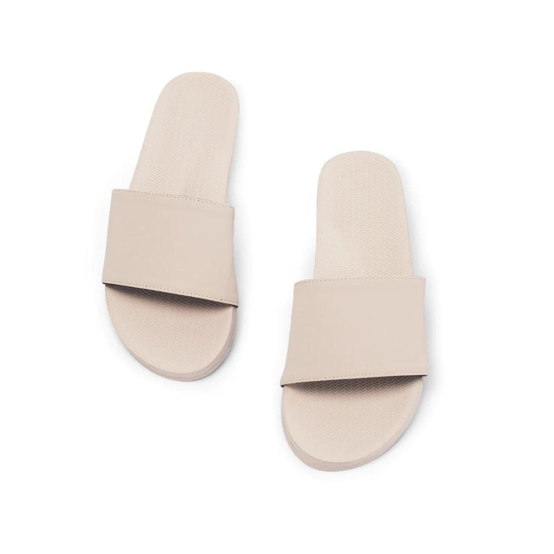 A pair of Women's Waterproof Slides Sandals in White / Sea Salt colour - single side white background