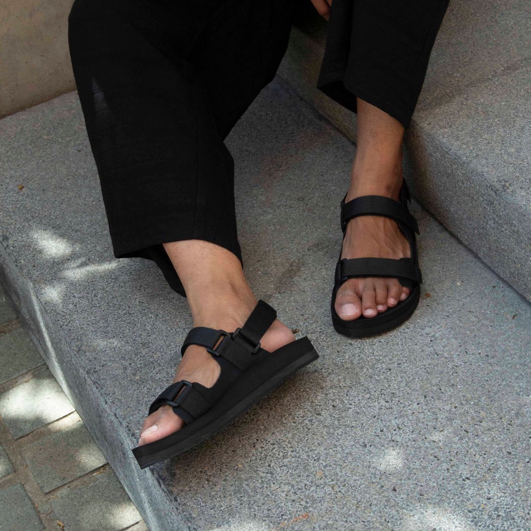Man wearing Hijack Indosole black adventure sandals in the city