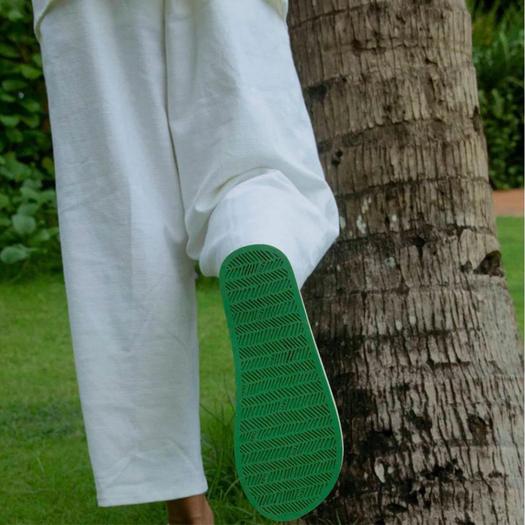 Man wearing Black Flip Flops with Lime Green Sneaker Sole 2