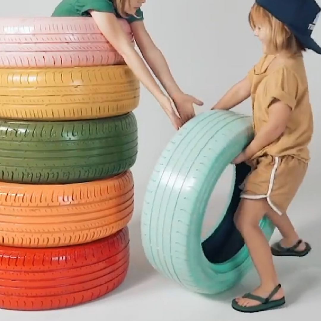 Toddlers playing wearing green leaf flip flops