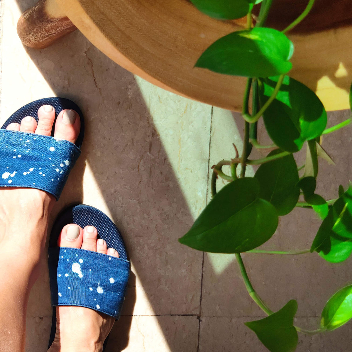 Woman wearing slides with Shore/Natural Indigo Drips style
